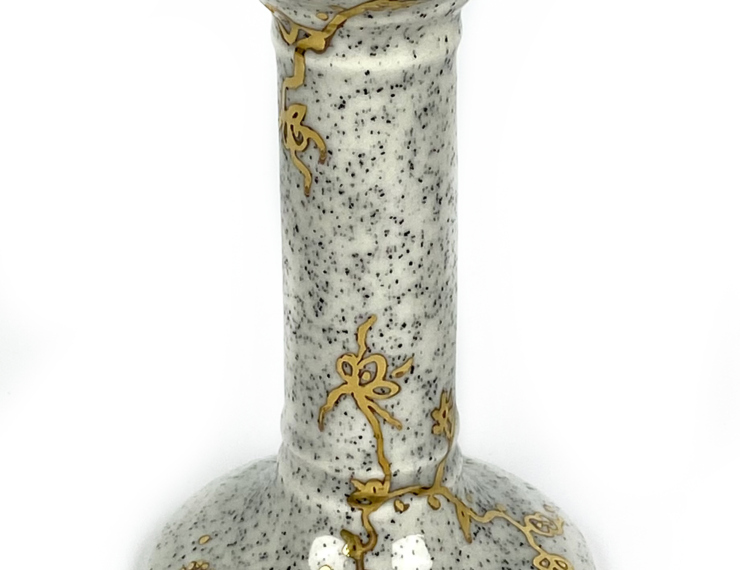 Kandelaar zwart wit gespikkeld met gouden bloemen